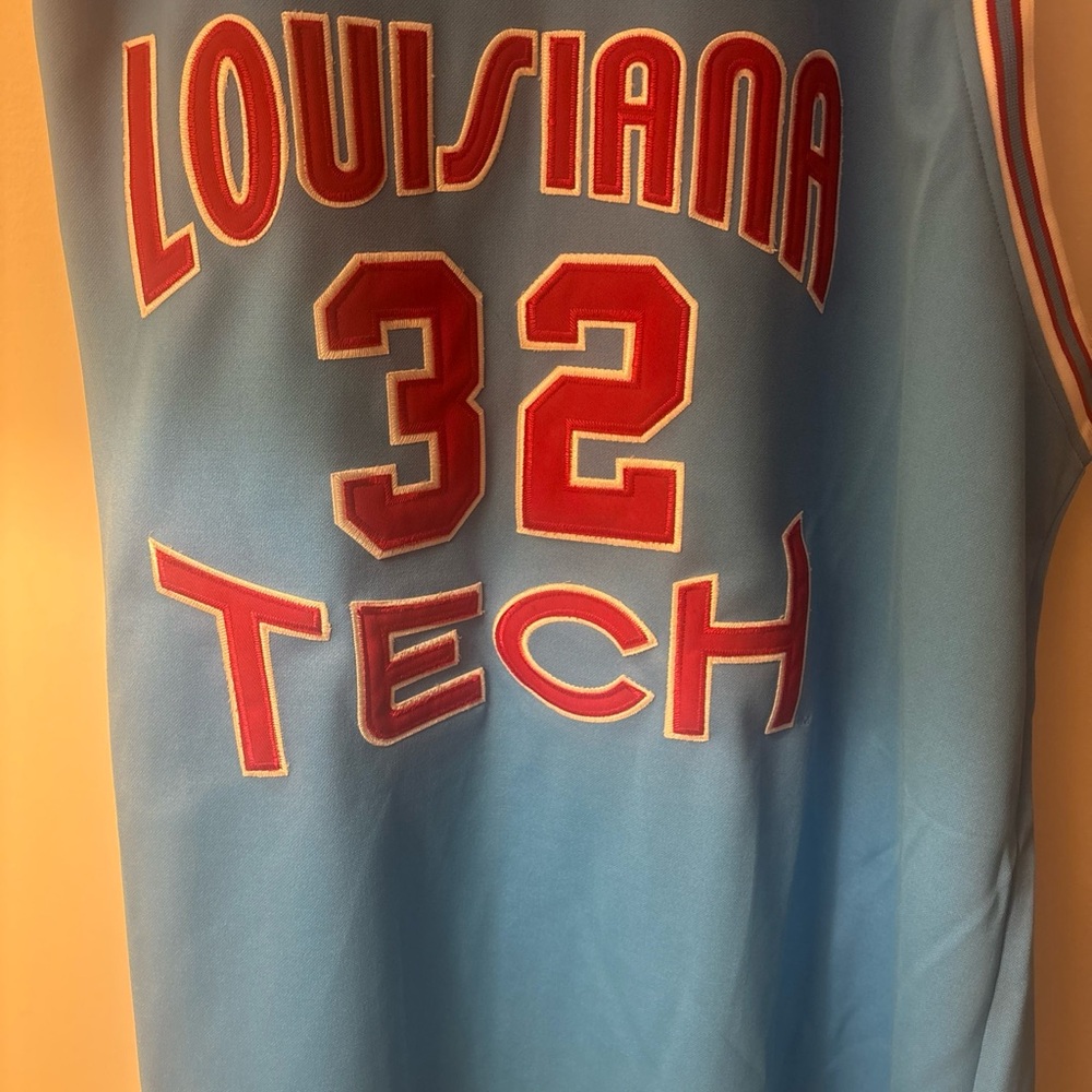 Blue and Red Basketball Jersey with Bold Athletic Font